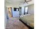 Comfortable main bedroom with ensuite bathroom and a view of backyard at 7925 S 24Th Way, Phoenix, AZ 85042
