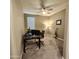 Cozy home office with a ceiling fan, a window for natural light, and ample workspace at 7925 S 24Th Way, Phoenix, AZ 85042