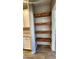 Walk-in pantry with custom wooden shelves, providing ample storage space at 7925 S 24Th Way, Phoenix, AZ 85042