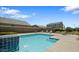 Community pool and sundeck features lounge chairs and tables, inviting residents to relax and enjoy the outdoors at 7925 S 24Th Way, Phoenix, AZ 85042