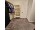 Large walk-in closet features custom shelving and plenty of room for organizing belongings at 7925 S 24Th Way, Phoenix, AZ 85042