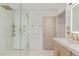Elegant bathroom showcasing a glass shower with gold fixtures and a marble vanity at 8119 E San Miguel Ave, Scottsdale, AZ 85250