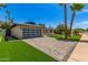Beautiful home exterior with a well-manicured lawn, modern garage, and inviting curb appeal at 8119 E San Miguel Ave, Scottsdale, AZ 85250