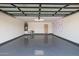 Spacious two-car garage with sealed floor, overhead storage, and modern lighting at 8119 E San Miguel Ave, Scottsdale, AZ 85250