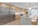 Bright kitchen featuring stainless steel appliances, wood cabinets, and a large island with seating at 8119 E San Miguel Ave, Scottsdale, AZ 85250
