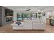 Bright living room featuring a modern fireplace, sleek floors, and seamless indoor-outdoor flow to the pool area at 8119 E San Miguel Ave, Scottsdale, AZ 85250