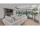 Bright living room with a modern fireplace, sleek floors, and easy access to the outdoor pool area at 8119 E San Miguel Ave, Scottsdale, AZ 85250