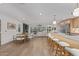 Open-concept living space with a modern kitchen, dining area, and cozy living room at 8119 E San Miguel Ave, Scottsdale, AZ 85250