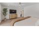 Bright main bedroom with TV and modern ceiling fan at 8119 E San Miguel Ave, Scottsdale, AZ 85250