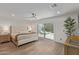 Bright main bedroom with access to the pool and a modern ceiling fan at 8119 E San Miguel Ave, Scottsdale, AZ 85250