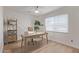 Well-lit office with decorative wall paneling, a desk, and built-in shelving at 8119 E San Miguel Ave, Scottsdale, AZ 85250