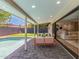 Covered patio with seamless access to the pool, putting green, and living area, perfect for entertaining at 8119 E San Miguel Ave, Scottsdale, AZ 85250