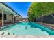 Private backyard pool offering a refreshing retreat with surrounding patio and lush landscaping at 8119 E San Miguel Ave, Scottsdale, AZ 85250