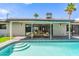 Inviting backyard pool with a tanning ledge, patio area, and seamless indoor-outdoor living at 8119 E San Miguel Ave, Scottsdale, AZ 85250
