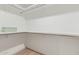 Spacious walk-in closet offering ample storage with built-in shelving and laminate floors at 8119 E San Miguel Ave, Scottsdale, AZ 85250