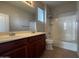 Bathroom featuring double sinks, large mirror, and shower with bathtub at 876 S Colonial Dr, Gilbert, AZ 85296