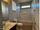 Bathroom with a shower-tub, toilet, vanity, and tile flooring at 876 S Colonial Dr, Gilbert, AZ 85296