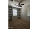 Interior bedroom with built-in bookshelves and carpeted floors at 876 S Colonial Dr, Gilbert, AZ 85296