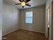 Bedroom featuring a window, ceiling fan, and carpet flooring at 876 S Colonial Dr, Gilbert, AZ 85296