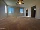 Bright bedroom featuring carpet floors, natural lighting, and a ceiling fan at 876 S Colonial Dr, Gilbert, AZ 85296