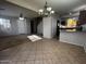 Open-concept dining area featuring a chandelier and tiled flooring at 876 S Colonial Dr, Gilbert, AZ 85296