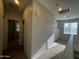 Hallway featuring carpet floors and natural lighting at 876 S Colonial Dr, Gilbert, AZ 85296