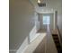 Upstairs hallway featuring a built-in storage unit and carpeted flooring at 876 S Colonial Dr, Gilbert, AZ 85296