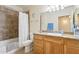 Bathroom featuring granite counters, tile flooring, and a tub shower combo, providing a functional space at 9450 E Becker Ln # 2067, Scottsdale, AZ 85260