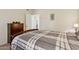Bedroom with a bed, wooden dresser, and ample natural light, creating a comfortable space at 9450 E Becker Ln # 2067, Scottsdale, AZ 85260