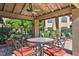 Outdoor community patio with ample seating and dining areas surrounded by lush greenery at 9450 E Becker Ln # 2067, Scottsdale, AZ 85260