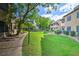Beautiful courtyard featuring manicured lawns, walkways, and well-maintained apartment buildings at 9450 E Becker Ln # 2067, Scottsdale, AZ 85260