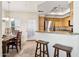 An open kitchen area with granite counters, stainless steel appliances, and bar stool seating at 9450 E Becker Ln # 2067, Scottsdale, AZ 85260