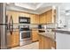 Well-equipped kitchen with stainless steel appliances, granite countertops, and ample cabinet space at 9450 E Becker Ln # 2067, Scottsdale, AZ 85260