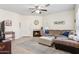 Spacious living room with a fireplace, comfortable seating, and a ceiling fan for added comfort at 9450 E Becker Ln # 2067, Scottsdale, AZ 85260
