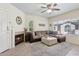 An inviting living room with a plush sectional sofa, fireplace, and elegant decor at 9450 E Becker Ln # 2067, Scottsdale, AZ 85260