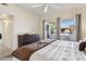 Inviting main bedroom features balcony access, neutral tones, and ample natural light, making it a serene space at 9450 E Becker Ln # 2067, Scottsdale, AZ 85260