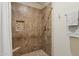 Tiled shower area features a built-in niche and grab bar, providing both style and safety at 9450 E Becker Ln # 2067, Scottsdale, AZ 85260