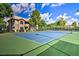Outdoor tennis court surrounded by lush landscaping, creating an inviting recreational space at 9450 E Becker Ln # 2067, Scottsdale, AZ 85260