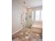Bright and spacious bathroom with a glass-enclosed shower, soaker tub, and hexagonal tiled floors at 10655 N 9Th St # 112, Phoenix, AZ 85020