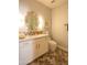Well-lit bathroom features patterned tile flooring, granite countertops and decorative oval mirror at 10655 N 9Th St # 112, Phoenix, AZ 85020