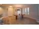 Bright dining room featuring light wood floors, modern chandelier, and floor to ceiling windows at 10655 N 9Th St # 112, Phoenix, AZ 85020