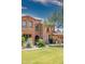 Beautiful two-story townhome with lush landscaping, a well-manicured lawn, and desert accents at 10655 N 9Th St # 112, Phoenix, AZ 85020