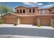 Spacious, three-car garage in light terracotta with a beautiful, covered balcony at 10655 N 9Th St # 112, Phoenix, AZ 85020