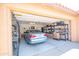 Organized two-car garage featuring ample shelving and storage space for convenience at 10655 N 9Th St # 112, Phoenix, AZ 85020