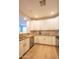 Well-lit kitchen with stainless steel appliances, granite countertops, and white shaker-style cabinets at 10655 N 9Th St # 112, Phoenix, AZ 85020