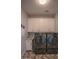 Convenient laundry room featuring modern washer and dryer with functional storage cabinets at 10655 N 9Th St # 112, Phoenix, AZ 85020