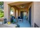 Covered patio with ceiling fan and comfortable seating, perfect for outdoor relaxation at 10655 N 9Th St # 112, Phoenix, AZ 85020