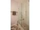 Glass shower includes built-in tiled bench and mosaic tile flooring at 10655 N 9Th St # 112, Phoenix, AZ 85020
