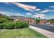 Beautiful community with mountain views, desert landscaping, and a light colored sedan parked nearby at 10655 N 9Th St # 112, Phoenix, AZ 85020