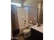 Cozy bathroom featuring a shower-tub combination and dark cabinets at 10773 W Prickly Pear Trl, Peoria, AZ 85383